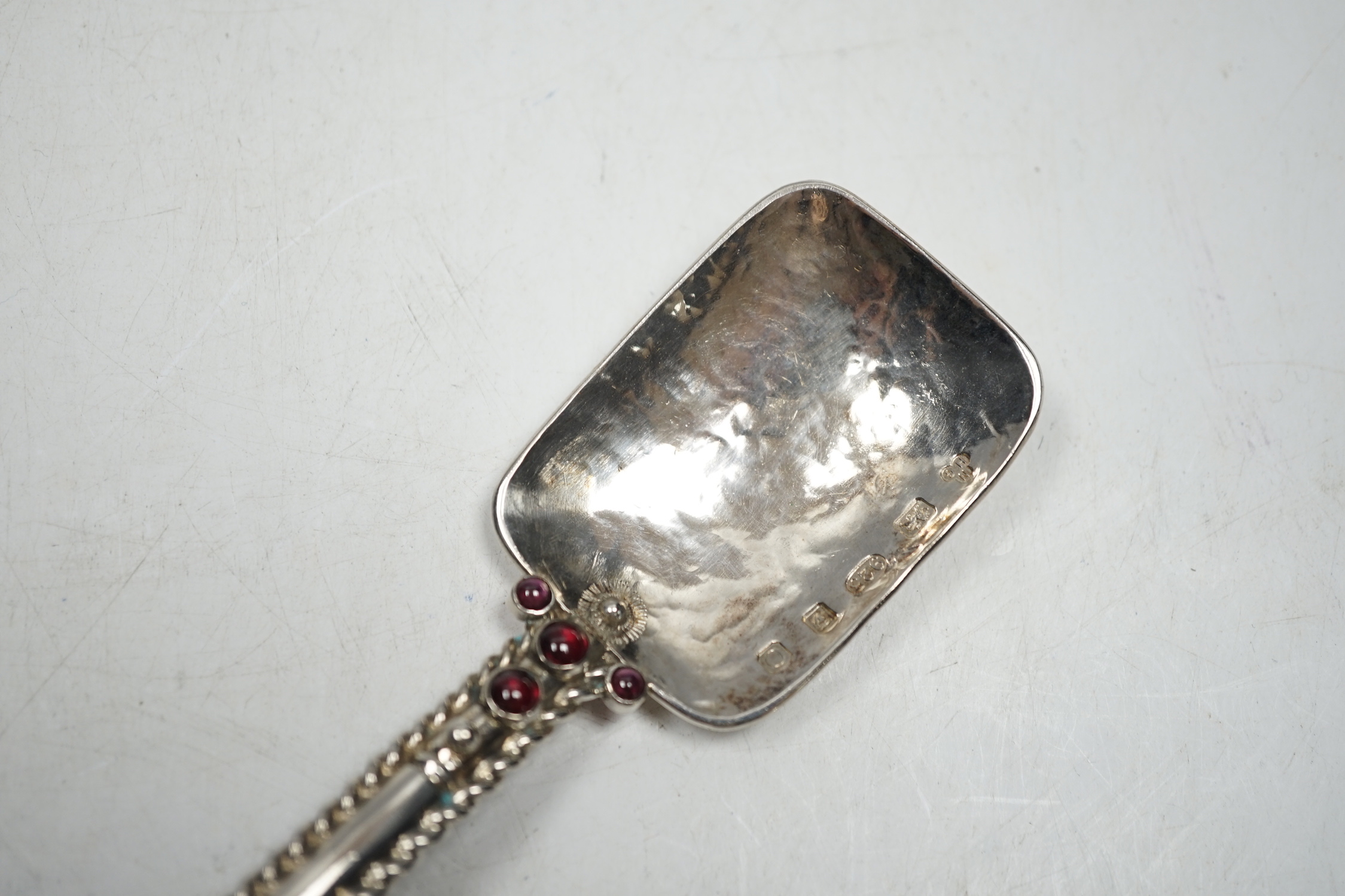 A modern Arts & Crafts silver and four stone cabochon garnet set spoon, maker HNG, London, 2013, 23cm, gross weight 115 grams.
